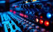 © Pumapala - Close-up of Audio Mixing Console with Colorful Lights