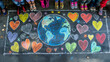 © Dmitriy - A group of children draw chalk hearts and a world map on a pavement, banner