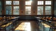 © Adisak - Empty classroom with sunlight streaming through windows.