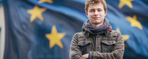 Canvas Print - Portrait of a young person with long blonde hair and blue eyes, smiling confidently, standing in front of an out-of-focus European Union flag. Free copy space.
