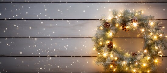 Poster - Festive Christmas wreath adorned with bokeh lights displayed on a weathered white wooden board, creating a cozy holiday ambiance, ideal for a copy space image.