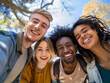 © Liudmila - Multicultural students taking selfies on college campus.  Happy lifestyle concept. Happy group of friends having fun together outside of school, back to school.