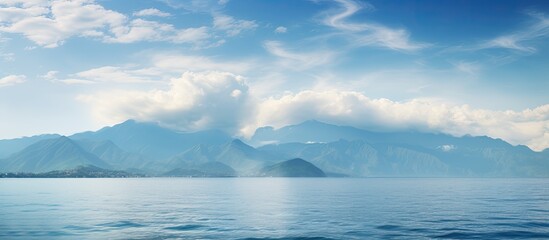 Aufkleber - Panoramic south landscape with a soft focus, featuring a vivid blue sea in the foreground and a distant mountain ridge on the horizon, perfect for a wallpaper with copy space image.