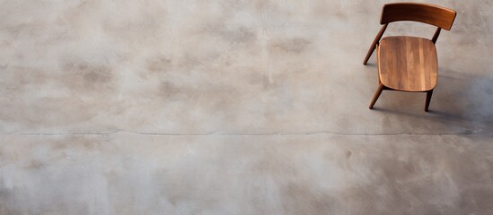 Aufkleber - Wooden chair seen from above on concrete surface with copy space image.