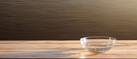 Leinwandbilder - Wooden table with a bowl of transparent water displayed, allowing for text in the copy space image.