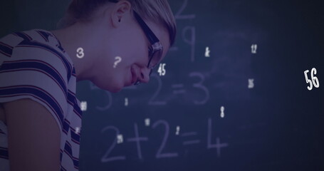 Poster - Image of numbers and symbols floating over diverse female teacher teaching a boy at school
