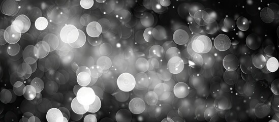 Poster - Blurry black and white bokeh providing an abstract background with a festive touch perfect for Christmas and New Year's, with copy space image available.