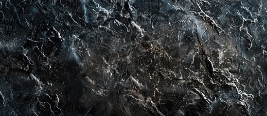 Leinwandbilder - A close-up black marble slab with a granite texture featuring a grainy rock surface design, ideal for construction industry layouts with copy space image.