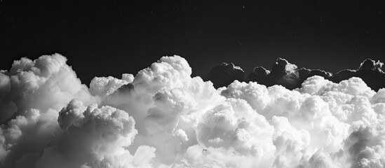 Poster - A white cloud against a black backdrop forms a visually appealing layout, perfect for displaying sleek and contemporary designs, with a perfect black background for emphasizing delicate features in a