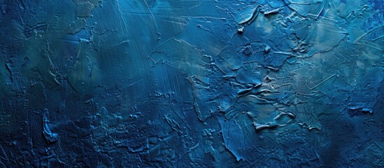 Poster - Blue painted texture on a toned wall, embedded with decorative plaster, creating an abstract backdrop with available copy space image for design.