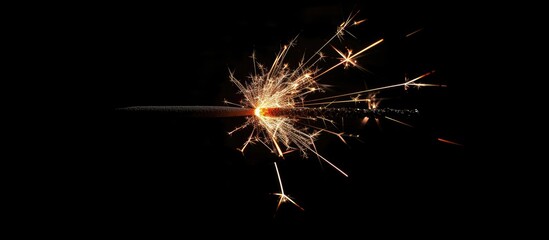 Poster - A festive Christmas sparkler displayed against a black backdrop, ideal for a copy space image.