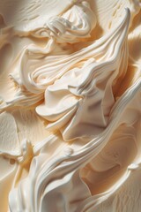 Wall Mural - The image is of a white frosting or icing that has a creamy texture. It is spread out and has a smooth, flowing appearance. The frosting is likely used for decorating cakes or other baked goods