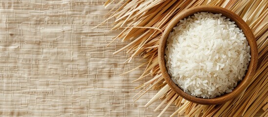 Poster - High-resolution top-view close-up of white rice in a wooden bowl with abundant copy space image.