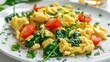 © Web - Spinach and Eggs. Rustic Omelet with Spinach and Tomato on a White Plate