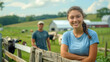 © ifoto - A photo of a young woman wearing blue athletic wear leaning on an old wooden fence in front of her farm
