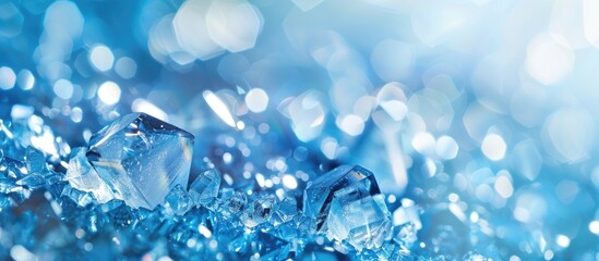 Wall Mural - Shiny crystals on an abstract blue background with copy space image.