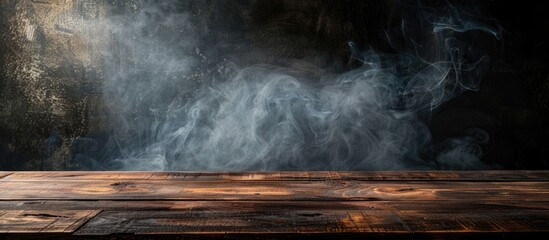 Poster - A dark background, an empty wooden table with smoke rising, offering copy space image.