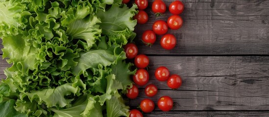 Poster - On a wooden backdrop, arrange cherry tomatoes and lettuce for a mockup with copy space image.