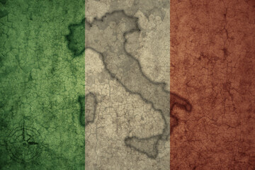 Wall Mural - map and flag of italy on a old vintage crack paper background .