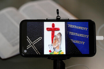 Canvas Print - Bible and religious images on a smartphone.