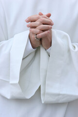 Hands folded in prayer. Spirituality.