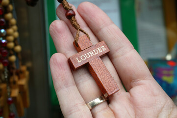 Wall Mural - Cross sold in souvenir shops in Lourdes. Lourdes sanctuary.  France.