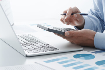 Poster - Accounting calculation. Calculating tax with calculator and laptop. Filing and paying taxes.