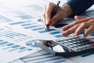 Poster - Business financial analysis. Analyst thinking of management strategy. Closeup of manager's hands pointing at graph of many reports.