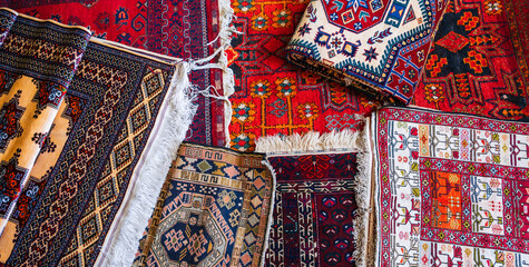 Wall Mural - traditional oriental Uzbek handmade colorful carpets at the bazaar in Uzbekistan in Tashkent