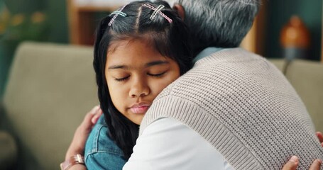 Poster - Hug, sad child and grandmother on couch for love, care and comfort or support in apartment. Help, girl and senior woman on sofa with embrace, together and kindness or affection for unhappy kid