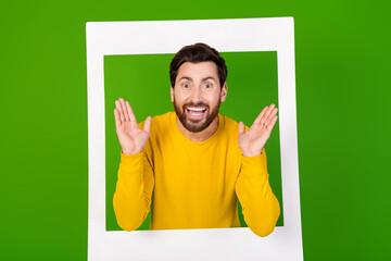 Canvas Print - Photo portrait of attractive young man instant photo frame amazed dressed stylish yellow clothes isolated on green color background