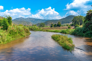 The Mae Tho river in the valley of the Thanon Thong Chai range, the Thai Highlands in the north-west. On the motorcycle tour of the Mae Hong Son Loop. A famous ride through the mountains