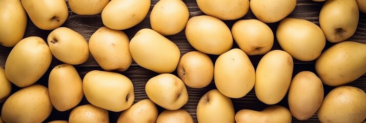 Wall Mural - A Bunch of Potatoes on a Wooden Background