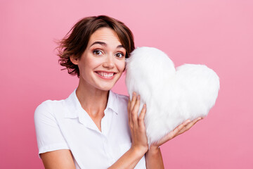 Poster - Closeup portrait of young lady hold fluffy surprise pillow heart figure celebrating happy valentine day isolated on pink color background