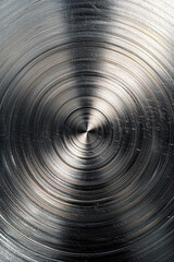 Poster - Close-up of a polished metallic surface with circular patterns. The texture and reflection reveal intricate details in the metal, offering an industrial feel.