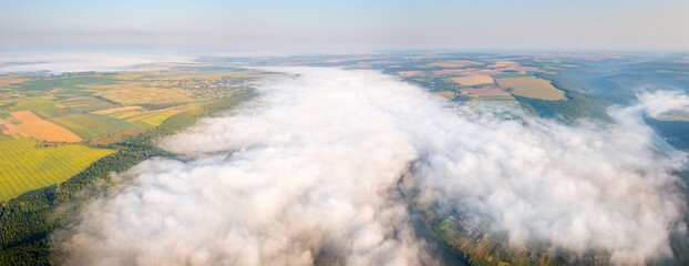 Canvas Print - Dense morning fog enveloped the farmland. Aerial photography. Beauty of earth.