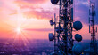 © javu - Telecommunication towers against a vibrant sunset sky