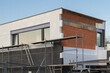 © ArieStudio - insulating the walls with modern thermal insulation materials. The new house construction process involves Exterior covering is applied at the construction site.