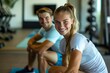 © Mike - A young woman and man are performing stretching exercises together, showcasing a healthy and active lifestyle.