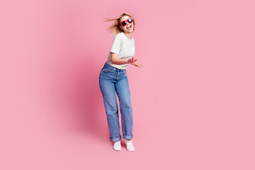 Wall Mural - Photo of good mood crazy girl wear stylish grey clothes dance have fun isolated on pink color background