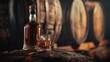 © iVGraphic - Bottle and glass of whiskey on barrel in distillery
