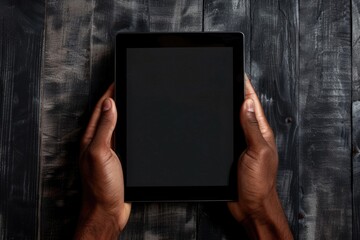 Poster - A person is holding a tablet with a blank or black screen, ideal for depicting technology or digital concepts