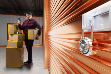 Wall Mural - Storage unit. Man with boxes at entrance to warehouse. Self storage unit is locked. Man with phone rents warehouse room. Storage unit inside building. Safekeeping room. Storehouse for personal items