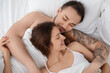 © New Africa - Lovely couple enjoying time together in bed at morning