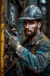 © lertsakwiman - Hardhat-wearing Construction Worker Repairing Electrical Equipment with Determination and Technical Expertise