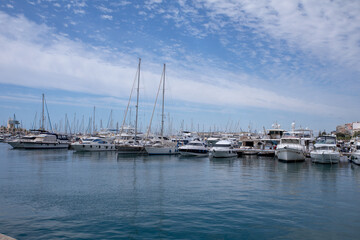 Docked Yachts Under a Sunny Sky in a Mediterranean Harbor