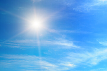 Wall Mural - Blue sky with white clouds and sun.