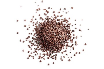 Wall Mural - A close-up shot of a heap of chocolate chips on a clean white surface