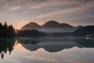 Wall Mural -  Witness the magic of a new day at Lake Geroldsee in Germany. 