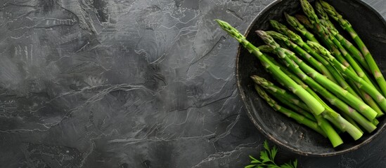 Wall Mural - Fresh Green Asparagus in a Rustic Bowl